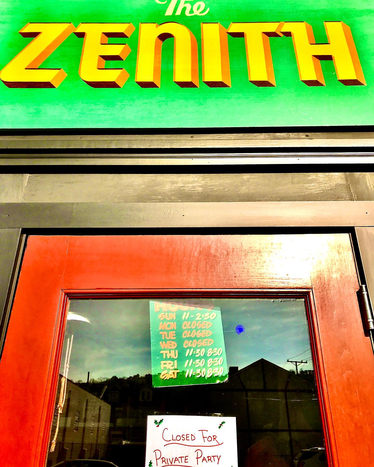 Photo of the sign above The Zenith door